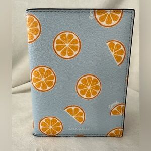 Coach Passport Case with oranges